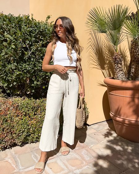Vacation outfit - white tank top, paper bag waist wide leg pants, rattan slide sandals, woven bag

// vacation outfits, spring break, summer outfit, summer outfits, vacay, resort wear, beach, pool, travel outfit, pants, casual outfit, neutral style, Petal and Pup #ltku #ltkunder50 #ltkseasonal #ltktravel #ltkitbag

#LTKunder100 #LTKFind #LTKstyletip
