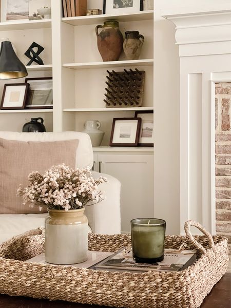 Living room decor, living room coffee table styling, decor books, candles, picture frames, shelf decor, shelf styling woven tray, 24” pillow, pottery barn, McGee and co 

#LTKhome #LTKSeasonal