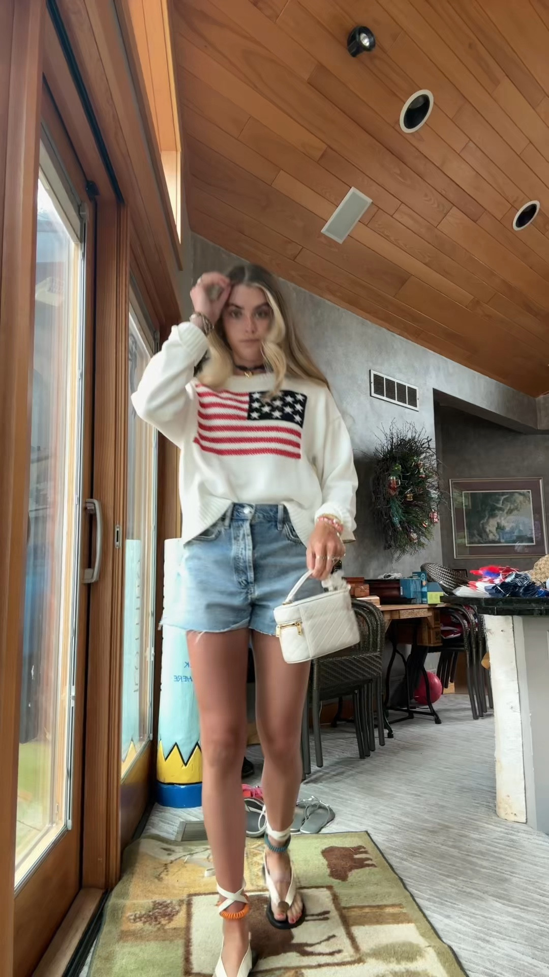 July 4th outfit! My @oldnavy American flag sweater I sized up to size small to make it baggy. My favorite denim shorts @nuuds  size 24. My wrap shoes are amazon and my bikini underneath is Tiger Mist.

#LTKootd #LTKTravel #LTKSeasonal