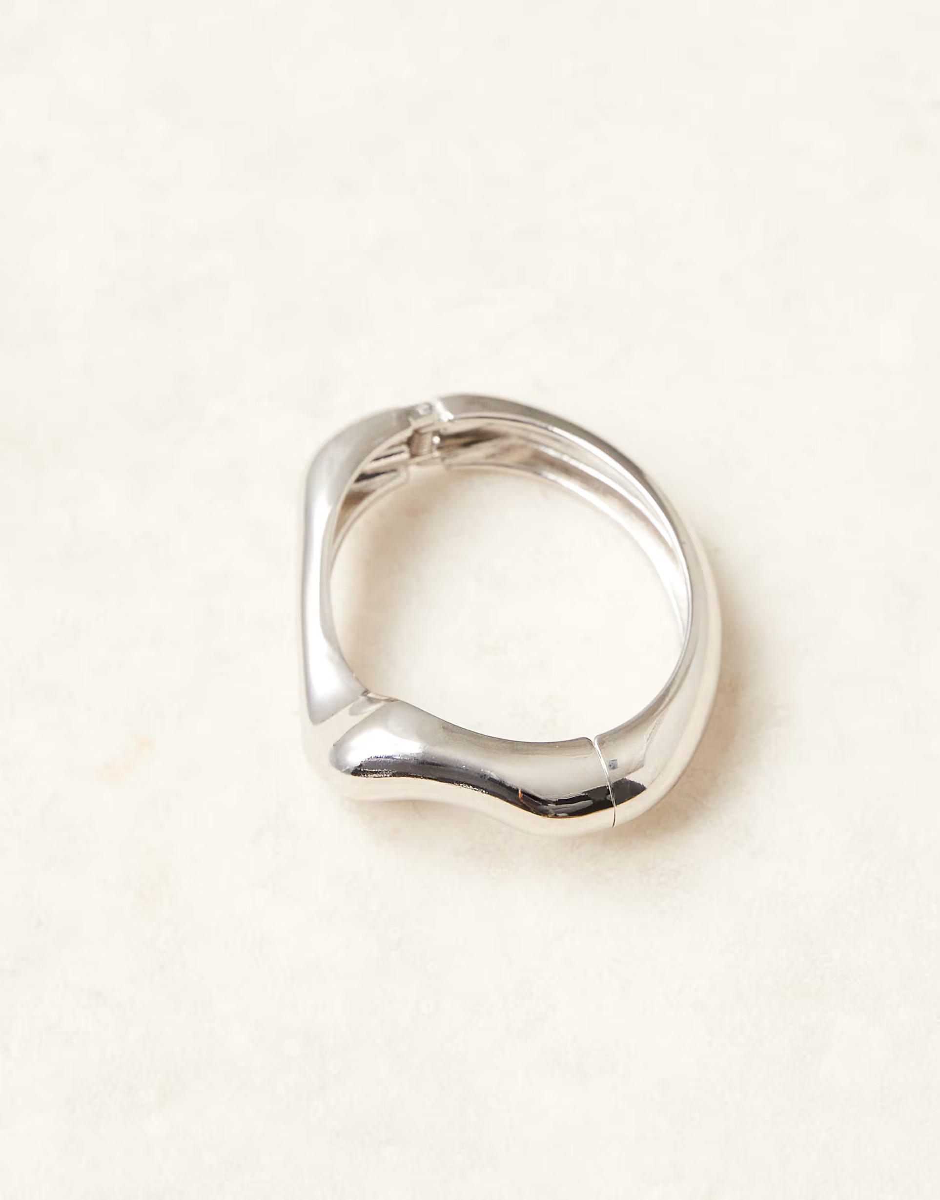 ASOS DESIGN  bangle bracelet in molten design in silver tone | ASOS (Global)