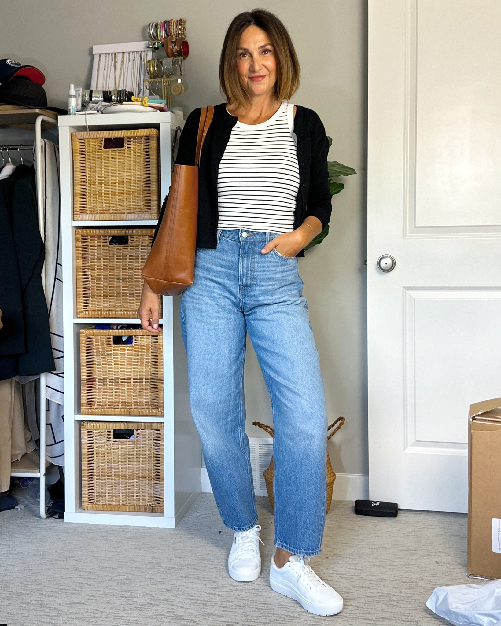 Early fall outfit, wear the cardi for the chillier mornings and remove when it gets warmer in the afternoon.
Wearing my usual S in the cardigan, 4 in the barrel jeans, sized up to M in the tank (has a built in bra!) but the S fit very similar.
My white sneakers are new, so comfortable and on major sale! Wearing my usual size.
The leather tote bag is such a classic bag, I’ve had mine for years and it’s great quality 


#LTKShoeCrush #LTKItBag #LTKSaleAlert