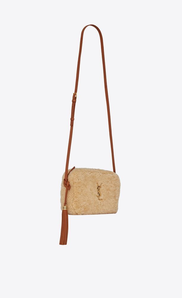 shoulder bag featuring an adjustable leather strap, removable leather tassel, interlaced YSL init... | Saint Laurent Inc. (Global)