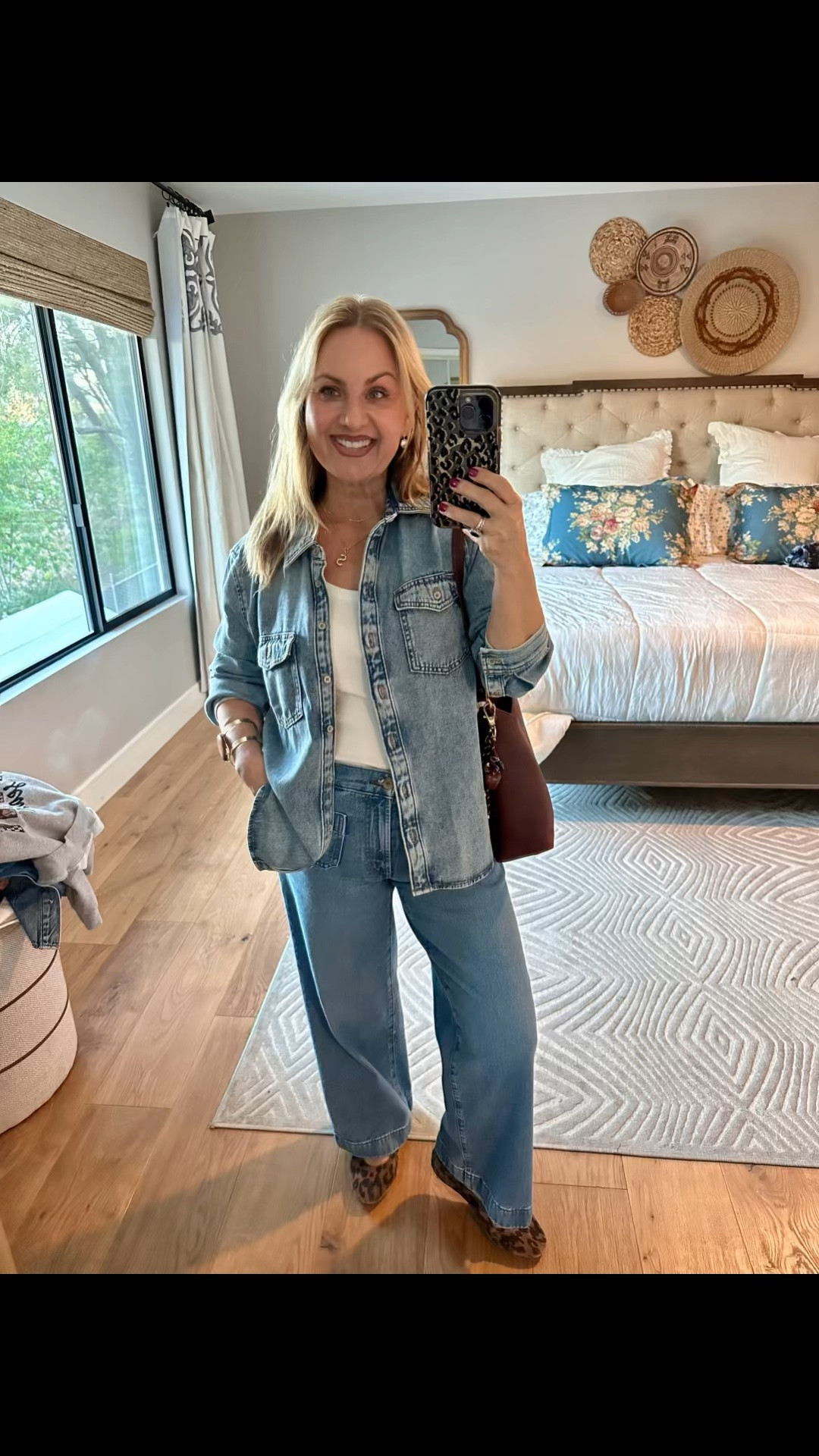 There’s just something about a denim-on-denim look that feels effortlessly cool — and this oversized denim shirt might be my new favorite layering piece! I love the relaxed fit paired with these wide-leg jeans. Comfy, casual, but still completely pulled together.

And because I can never leave an outfit too predictable… leopard shoes for a little sass 🐆 and my Portland Leather full-grain leather bag in the prettiest rich nutmeg color. 🤎

This is exactly my kind of outfit — easy pieces, a little personality, and cute enough to wear just about anywhere.

Who else is loving the denim-on-denim comeback? 💙

#LTKootd #LTKPetite #LTKOver40