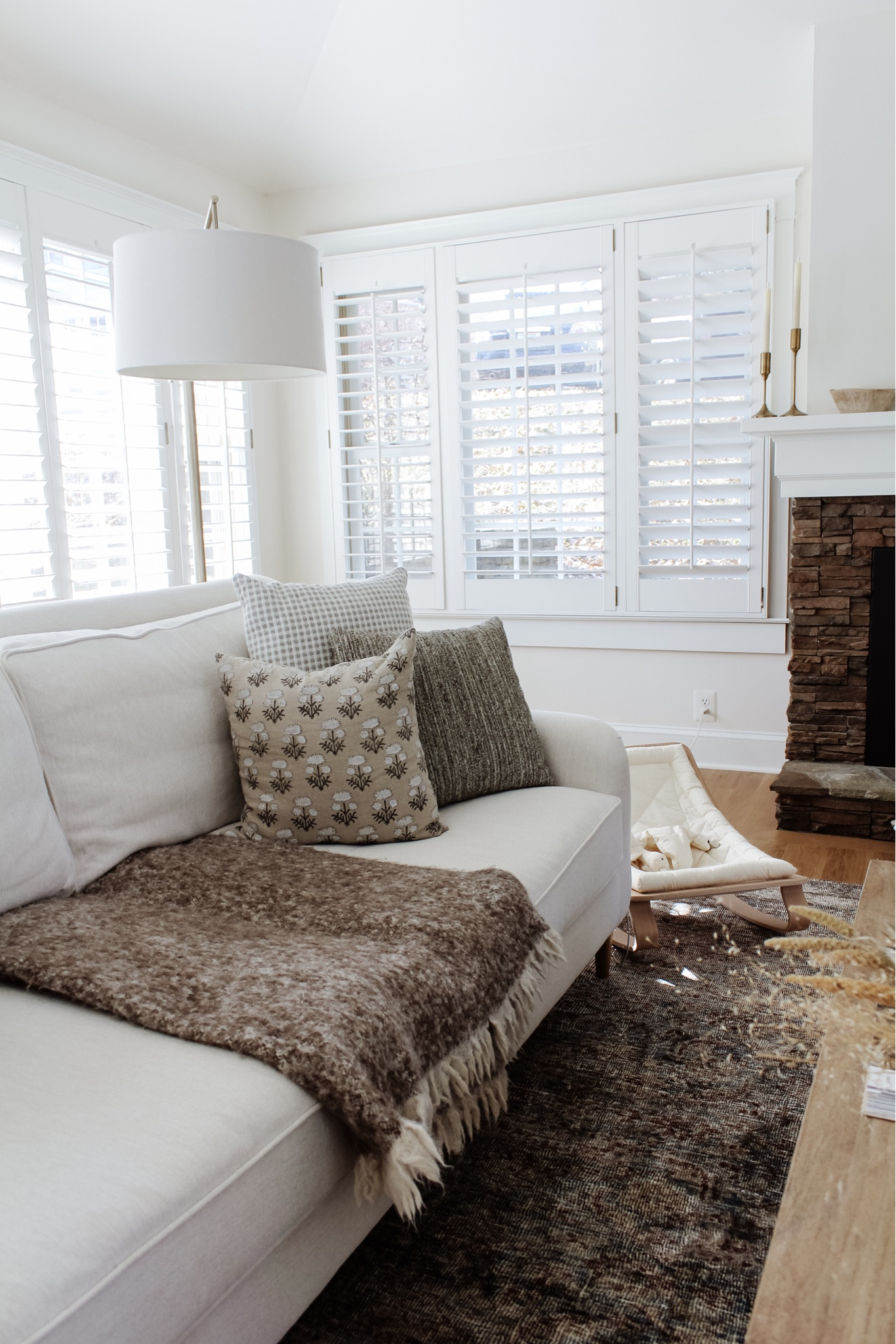 Spending most of my days in this little corner with baby and so grateful for how it’s shaped up in the temporary ✨ In case you missed it, a lot was shared this week to inspire your happy home - no matter what stage you’re in! Catch up via stories. Thanks for being here 🤍
•
•
•

 #traditionalhome  #newhomeideas #smmakelifebeautiful #flashesofdelight #homeimprovements #mybhg #homesweethome #cozyhome #livingroominspo #traditionalhomes #flashesofdelight #lightandairy #pillowarrangement #livingroom #livingroomdecor #livingroomstyle #livingroomstyling #coffeetabledecor #coffeetablestyling white sofa, slope arm sofa, traditional sofa, loloi rug, moody living room, neutral living room, gold mirror, fireplace mantel decor, coffee table decor, spring home decor 

#LTKhome #LTKunder50 #LTKsalealert