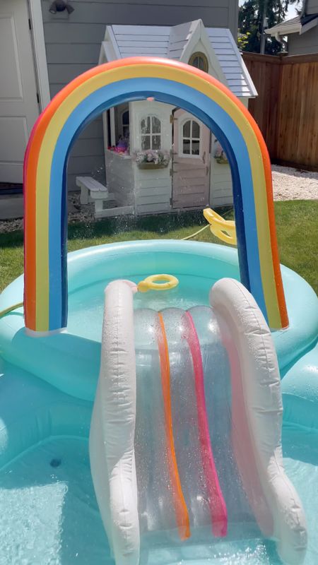 Backyard pool party for kids and toddlers with rainbow inflatable pool, water table, and baby inflatable pool

#LTKswim #LTKbaby #LTKkids
