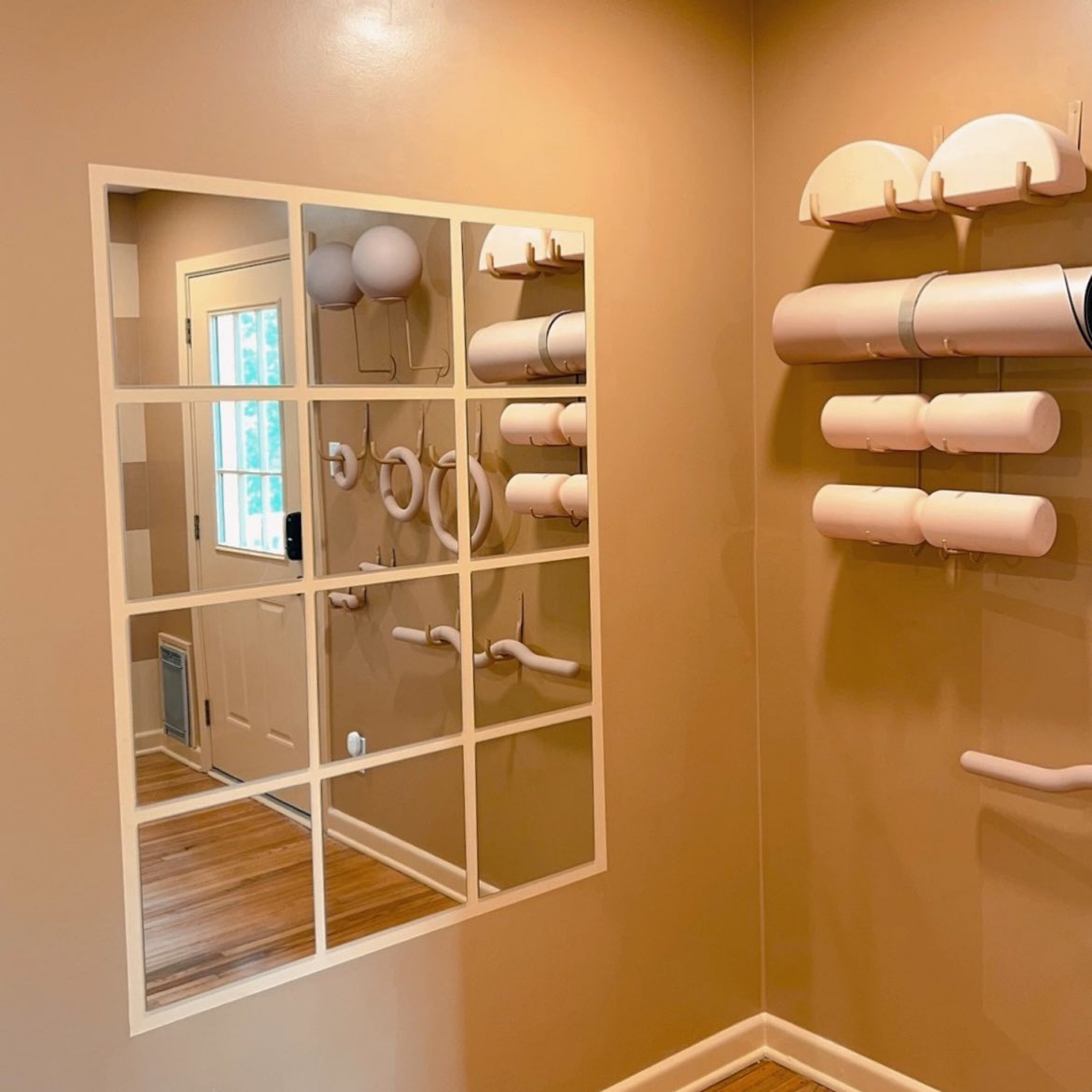 mirrors used / how to create this mirror wall & get perfectly crisp painted lines 

1. measure out the frame size needed using painters tape & a level 
2. instead of painting the new color you want- paint along the edges of the tape with the color that is already on the wall 
3. once that drys- then use the the new color you are wanting for the painted “frame” and fill in the area you have taped off- let dry 
4. lastly- measure out and carefully place each mirror panel to get the layout you want. these mirrors came with a super strong adhesive on the back so hanging them was very easy !  

#diyhome #mirrorwall 

#LTKhome