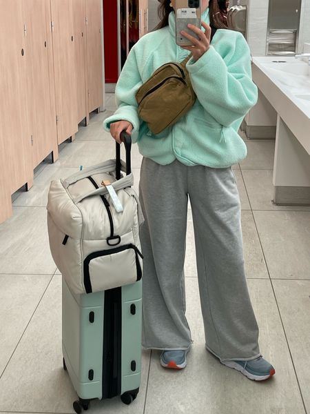 duffel (approved as personal bag), carry-on suitcase, cross body bag, and fleece! Wearing small- comes in multiple colors :)  sweatpants are greybandit (code is always VIVIANE15) and hokas linked! 

#LTKtravel #LTKstyletip #LTKunder100