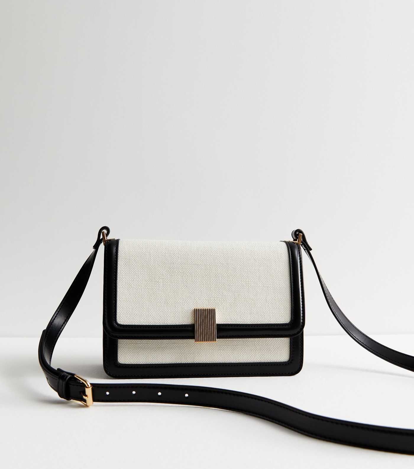 Black Canvas Boxy Cross Body Bag
						
						Add to Saved Items
						Remove from Saved Items | New Look (UK)