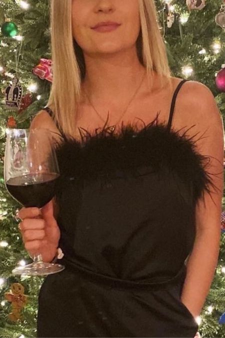 This black satin cami with feathers is perfect for any holiday party and holiday outfits! 🎊🎉 

#LTKunder50 #LTKSeasonal #LTKHoliday