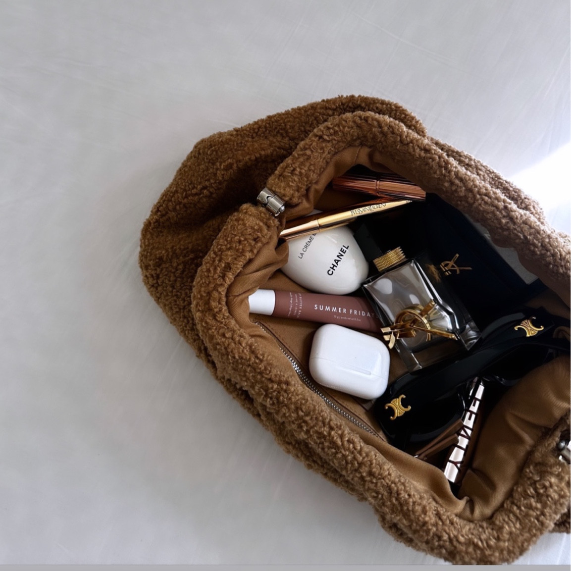 Essentials beauty favorites  - what’s in my bag ✨ floral with a hint of lavender orange and musk

#yslbeauty 
#sephorabeauty 
#summerfriday 
#perfumelovers

#LTKU #LTKbeauty #LTKHoliday