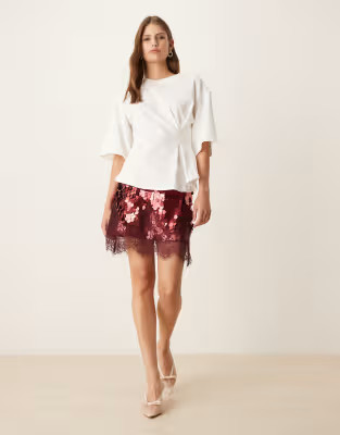 Never Fully Dressed Maeva mini skirt in large sequin in burgundy with lace trim | ASOS (Global)