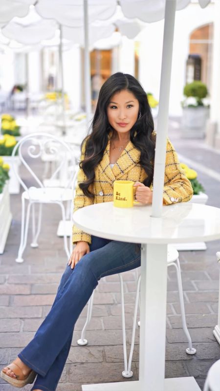 Padded shoulders are back to add shape and structure to jackets which have a vintage feel. I love the cropped style of this yellow tweed jacket by Assignment! It does not overwhelm my petite frame and pairs well with the proportions of the flared Jean. The yellow color is bright and makes me feel like I am walking on sunshine!

The denim trend for spring 2023 are flared jeans a nod to the 1970’s. These pull on jeans by Spanx are both comfortable and flattering. The zipperless and pocketless style add to the slick fashionable silhouette. 

I love pairing this look with dainty accessories! Butterfly necklaces and butterfly rings with a be kind message! La La Land Kind Cafe did a collaboration with Fossil and I love it! 