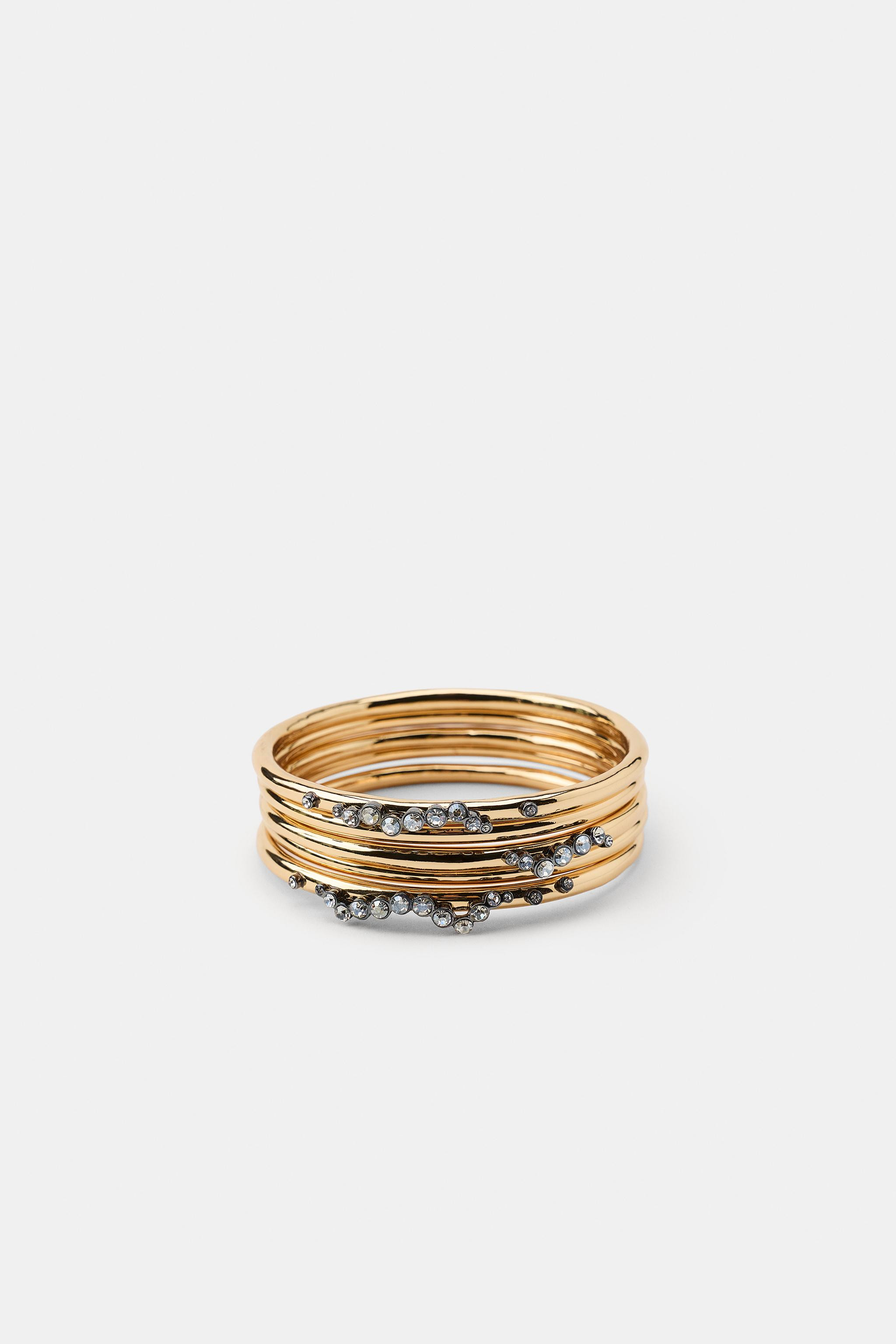 Pack of five rigid metal bracelets with contrasting rhinestone appliqu\u00e9s. | Zara US
