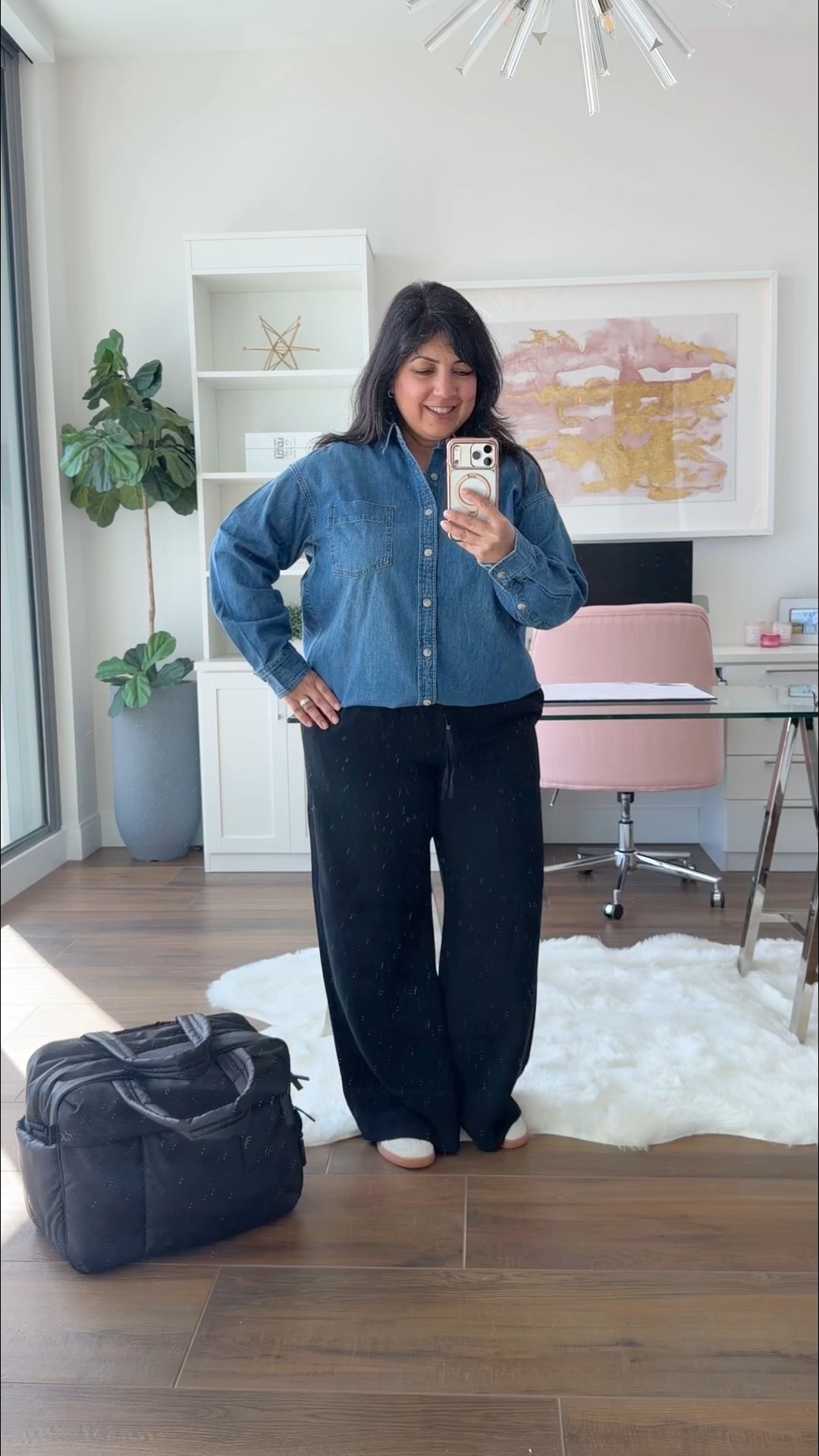 Aritzia Winter Sale! Up to 50% off ! This brand is new for me and I’m trying some new to me pieces that live up to the rave reviews! 

Aritzia denim shirt size Small. Runs big and is very generously cut with an oversized fit. So soft and comfy and not stiff at all. Aritzia Lodge pants in size large short. Love the crepette material that’s perfect for travel and can be worn casually with sneakers as seen here or dressed up with flats or heels for a dressier look. Perfect for workwear too. Such a versatile pair of black pants to have in your wardrobe. Available in lots of colors! Adidas handball Spezial sneakers. These run big so size down. I normally wear a 7.5 or 8 in shoes and I wear these in size 7. CALPAK Luka duffel bag.

Perfect gifts for the frequent traveler and such a great travel outfit! 


#LTKPetite #LTKMidsize #LTKTravel
