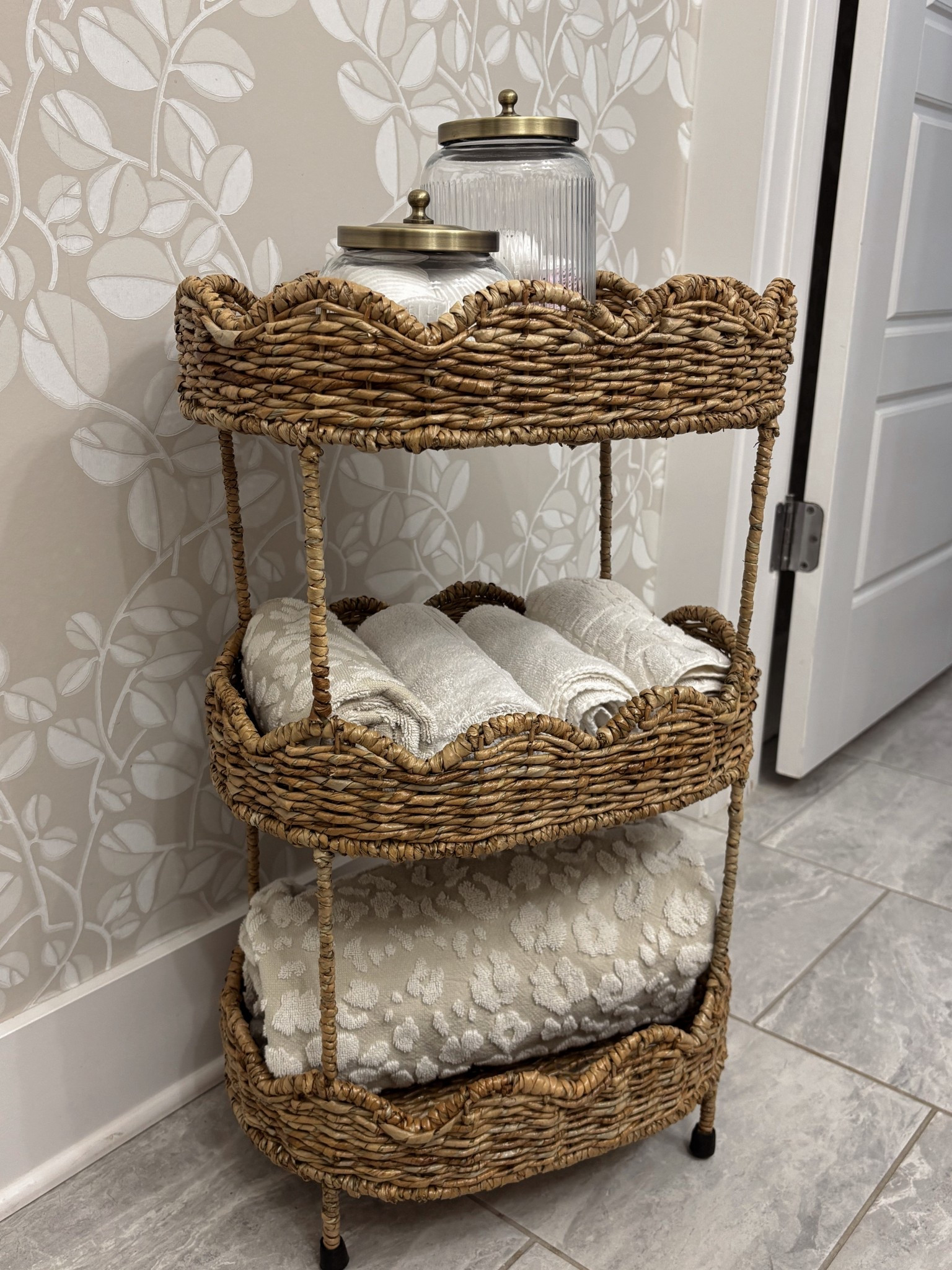 Scalloped rattan bathroom shelf! 

#LTKHome #LTKSummerEdit