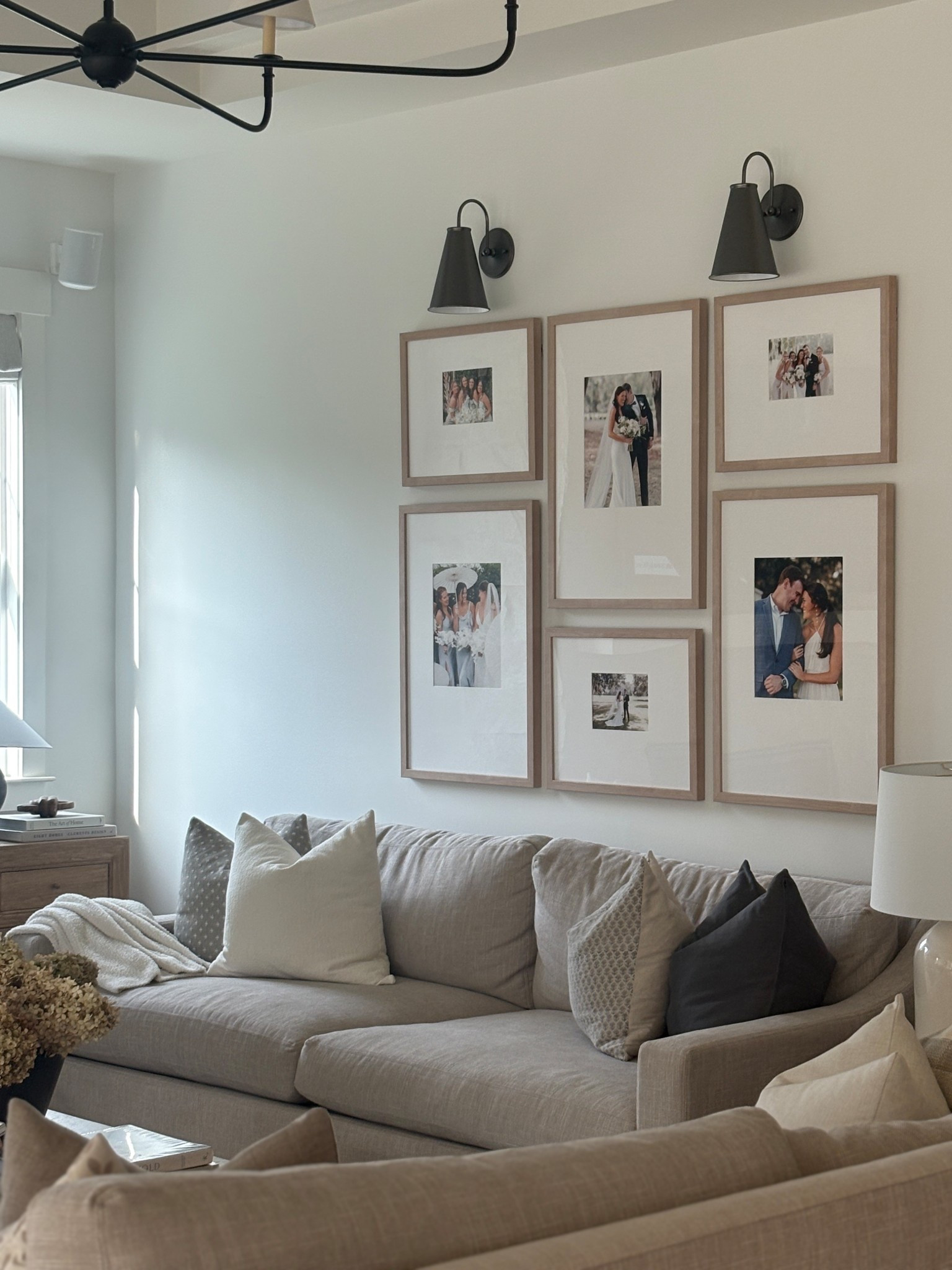 A neutral living room with a gallery wall that feels personal but still polished 🤍
Soft upholstery, warm wood frames, and classic wall sconces make this space feel layered and timeless. Everything linked. 

 

#LTKHome