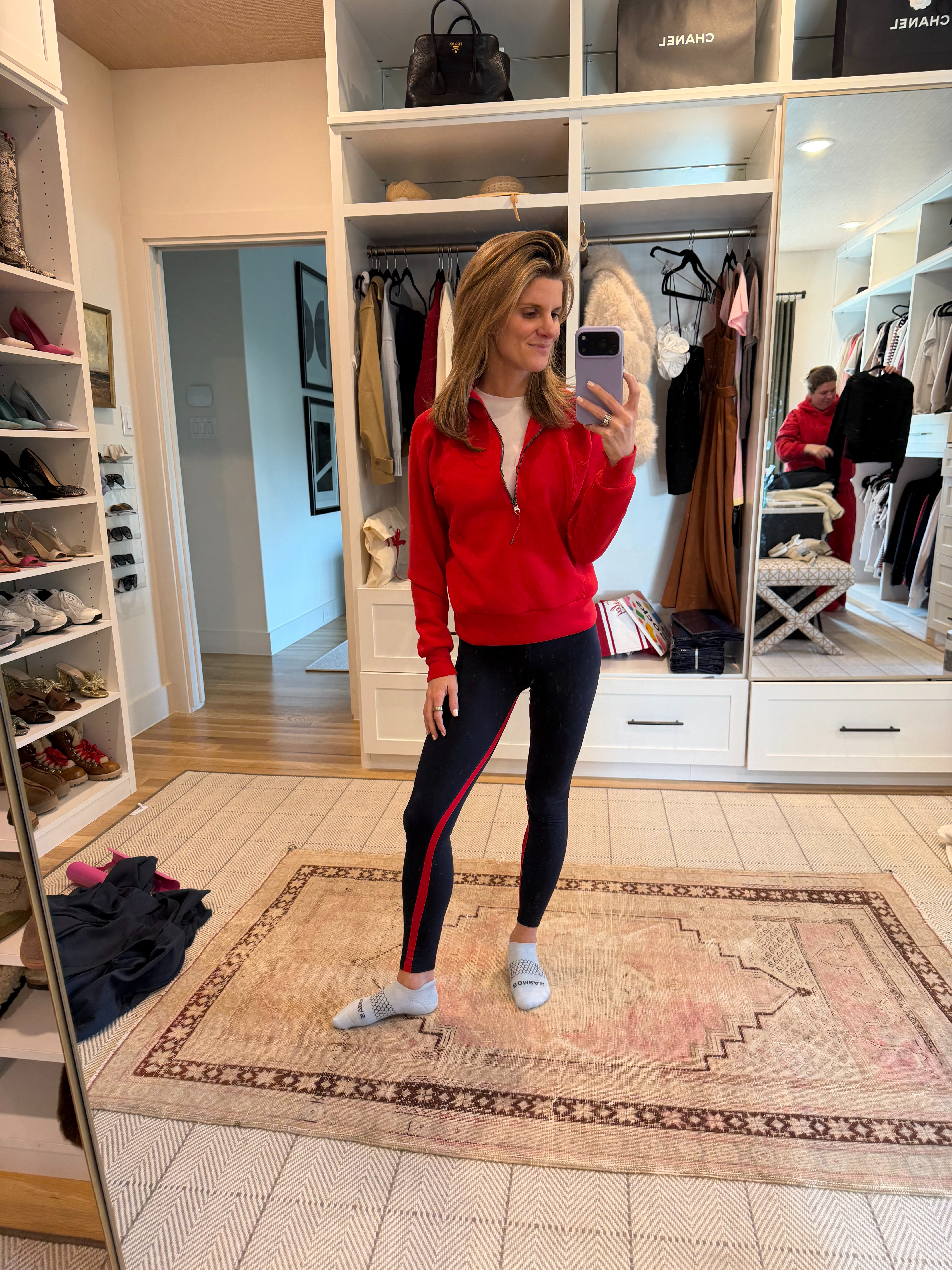 Leggings - SPLITS59 (XS). White Tee - Vuori (XS). Red Pullover - Spanx (XS).  

 