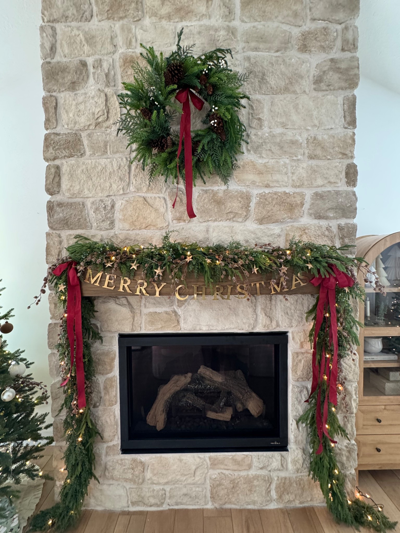 Christmas fireplace. I’m really loving the red this year. Deets on the garland, bows and metal merry Christmas banner

#LTKSeasonal #LTKHoliday #LTKHome