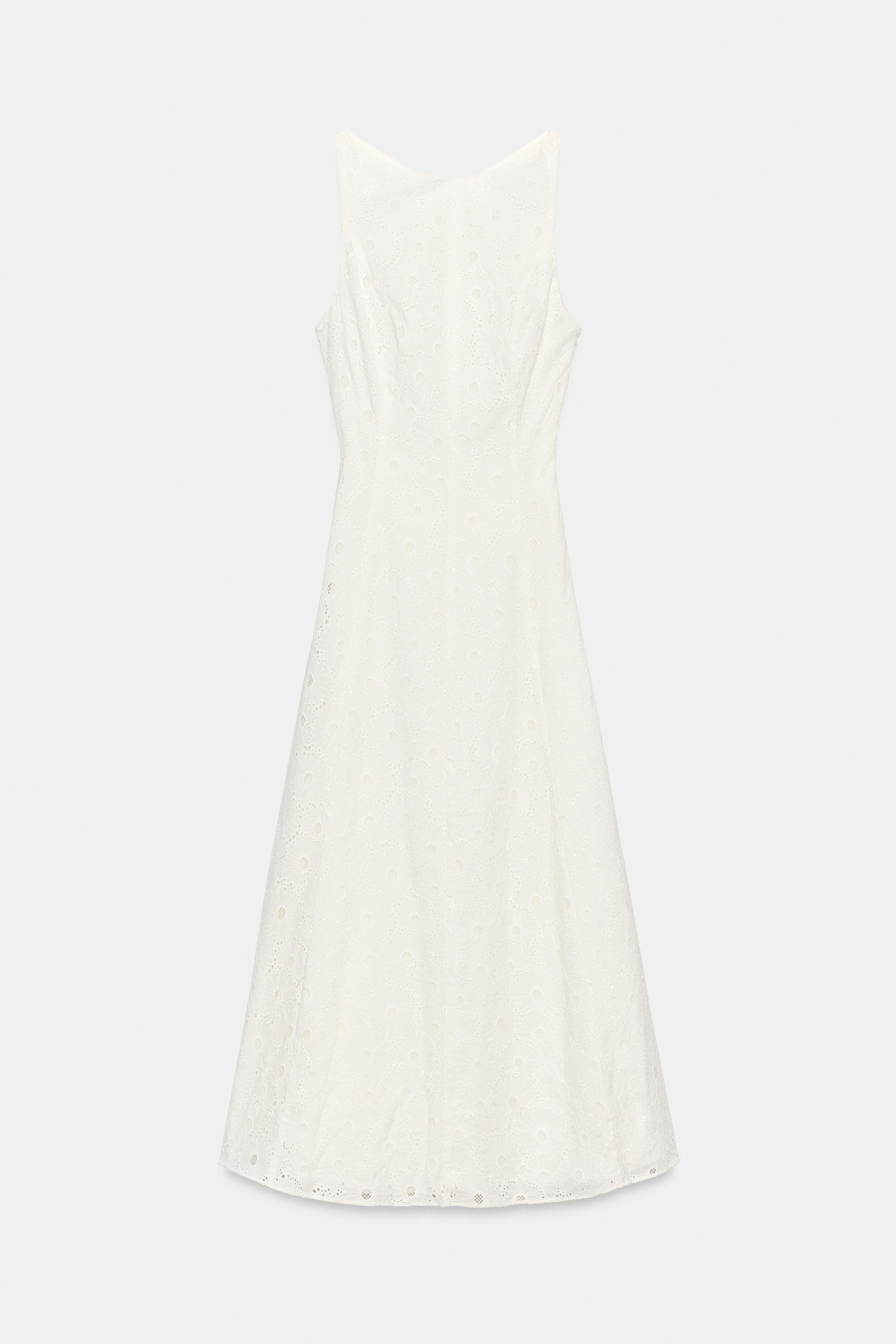 Model height: 170 cmMidi dress with a boat neckline, open back and sleeveless design. Featuring c... | Zara UK