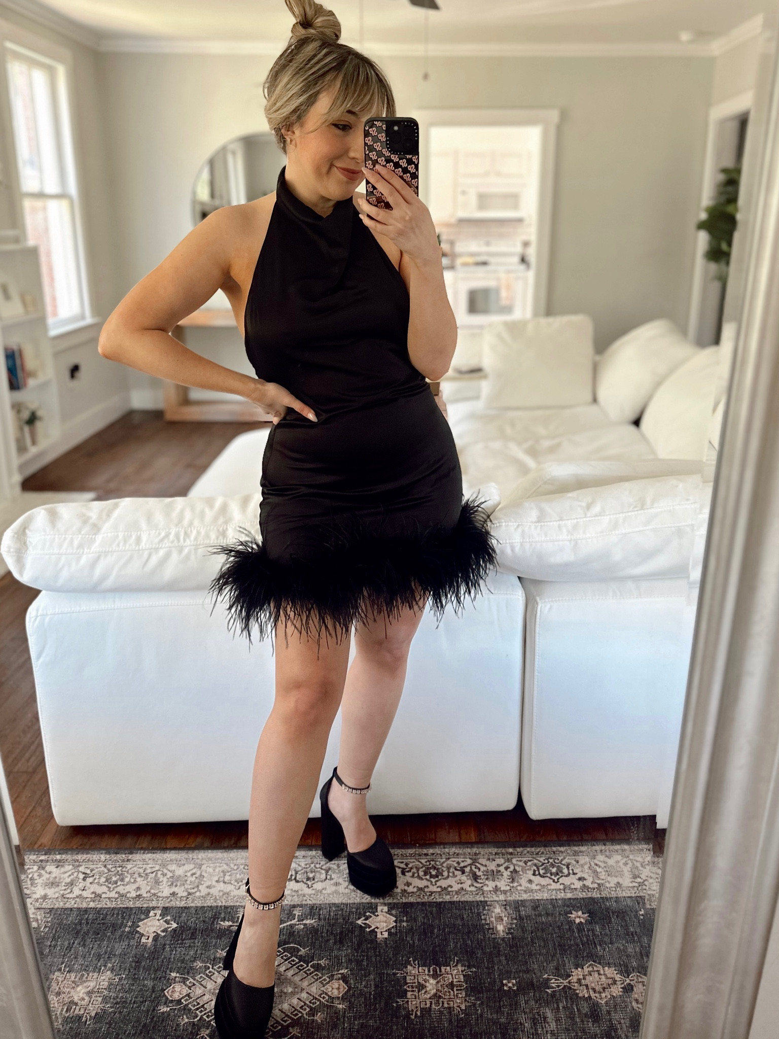 This gorgeous satin halter dress is the perfect glam cocktail dress! I love the feather trim and low back! 

#LTKstyletip #LTKSeasonal