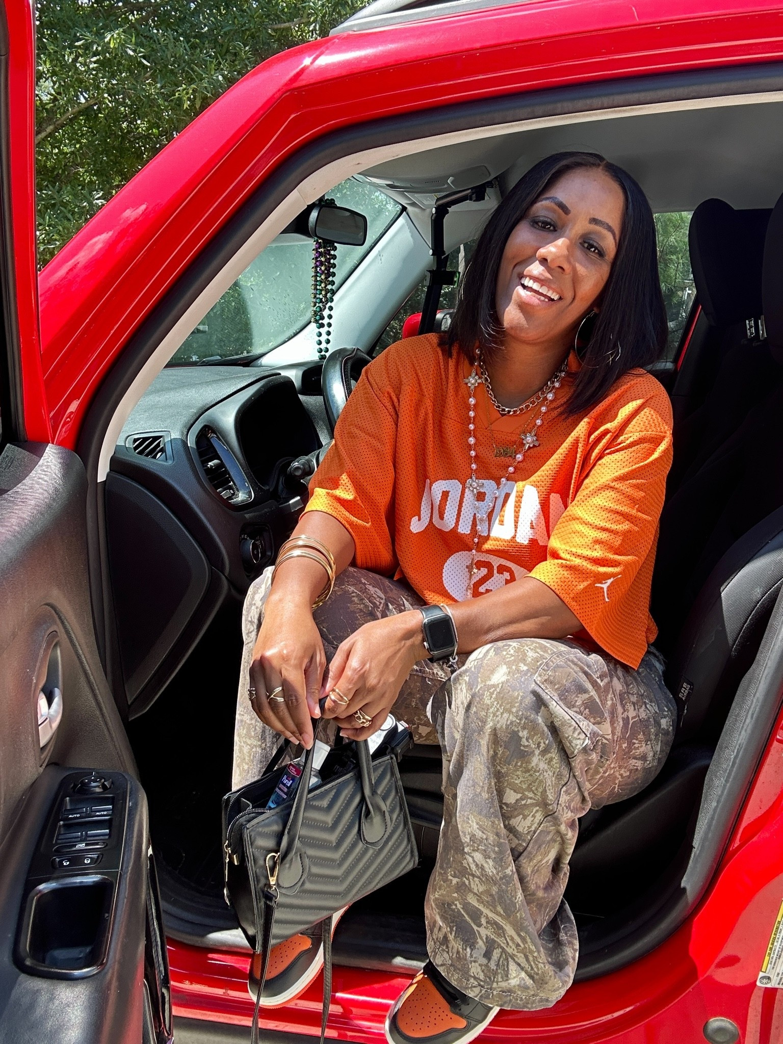 I styled the camo cargo pants with an oversized orange Jordan graphic T-shirt and a pair of orange sneakers.

#LTKootd #LTKOver40 #LTKPetite