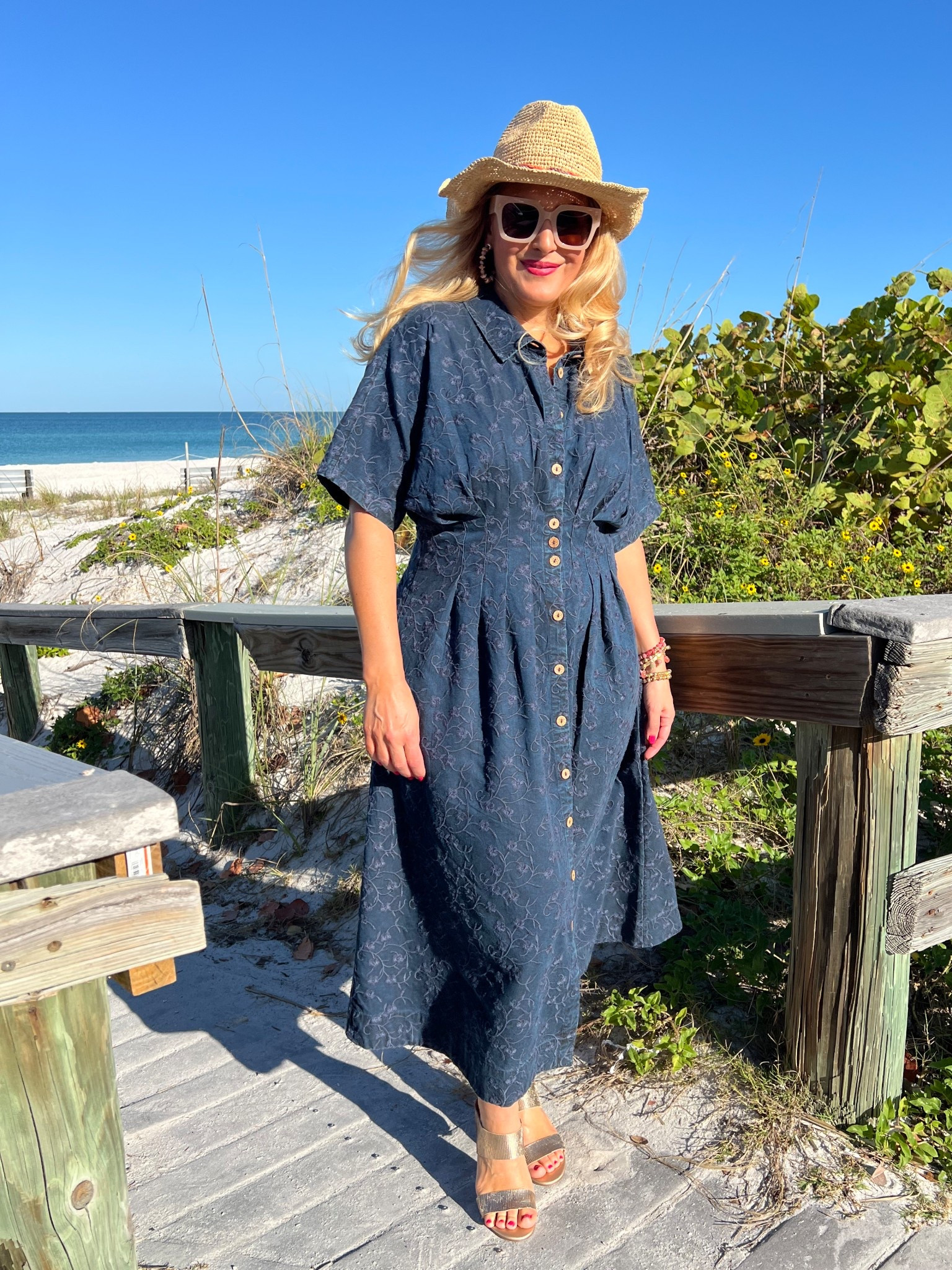 🏝️SOFT SURROUNDINGS: #ad Packing for a beach getaway? Here’s the dress you need! @soft_surroundings #softsurroundings

👗My embroidered short sleeve midi dress flatterers with front and back tucks that define your waist. Love the tonal embroidery and beautiful floral pattern. You can wear this meeting friends for a lunch date, a beach getaway or everyday wear. Effortless style + versatility + breathable fabric = The dress you need!

🫶🏻Truly looks like a sophisticated denim dress. Buttons down the front, has side pockets and so soft! I’m wearing a medium and it fits true to size. Available in XS-3X. Color: Embroidered medium wash.

👒When heading out to the beach, don’t forget to pick up my Catalina Cowboy hat! This raffia hat features a colorful braided faux suede hatband and has an interior adjustable sweatband that makes it comfy. Also love the shapeable three inch brim to offer extra sun protection. 

🙌🏼In addition to my hat, I’m wearing a set of five bracelets with matching earrings. The genuine rhodonite beads in pinks, golds and earth tones look fantastic for spring and summer.

👡You can’t forget about these insanely comfortable textured sandals. Obsessed! This golden leather sandal has a soft shimmer and glow. Elevated and chic. You’ll be reaching for these all spring and summer long. I walked around all day and my feet felt great. Order your normal size. These are fantastic!

👉🏼Follow my shop @jtstjtst11 on the @shop.LTK app to shop this post and get my exclusive app-only content!

#liketkit 
@shop.ltk

#LTKSeasonal #LTKOver40 #LTKSaleAlert #LTKMothersDay #LTKTravel #LTKgrwm #LTKootd #LTKMidsize #LTKSwim #LTKFestival 