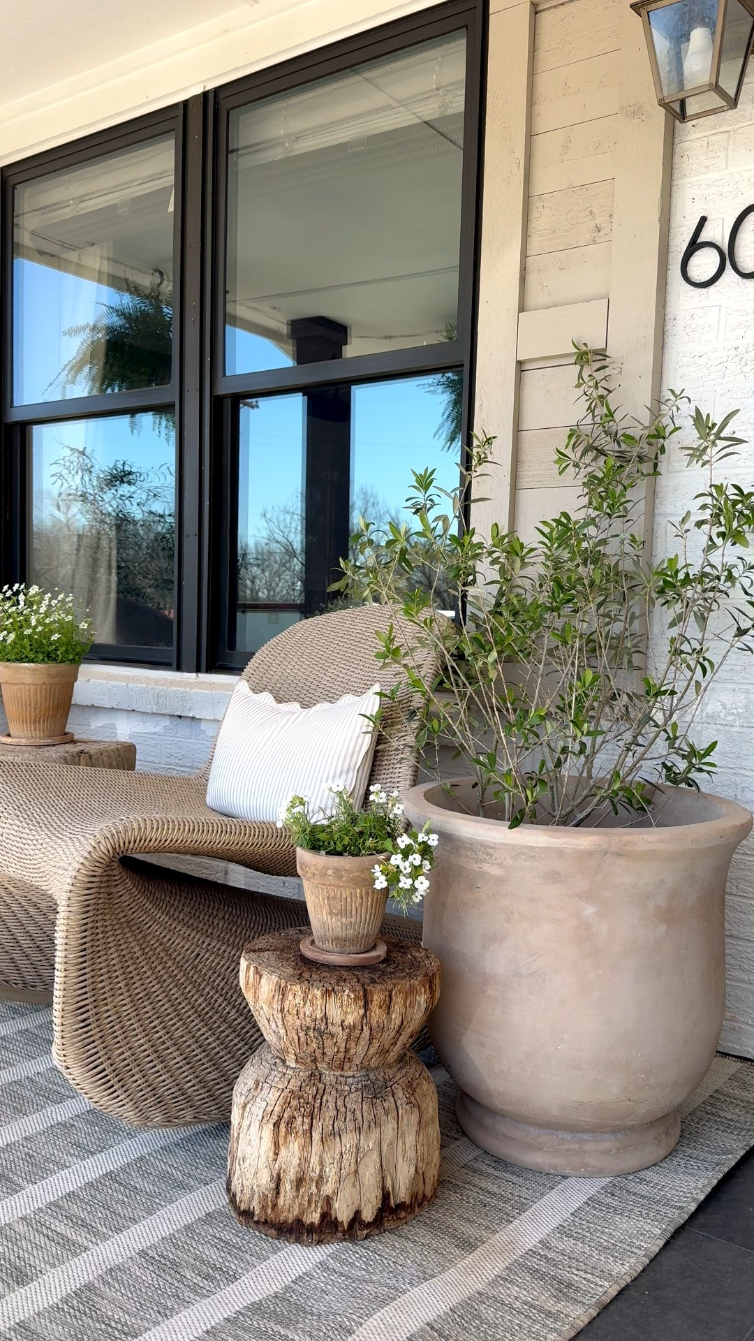 Spring front porch! I use real olive trees. The first large planter is from At Home and my stump tables are no longer sold from Antique Farmhouse. I linked everything else I could! This outdoor rug is affordable and durable! 

#LTKHome #LTKSeasonal