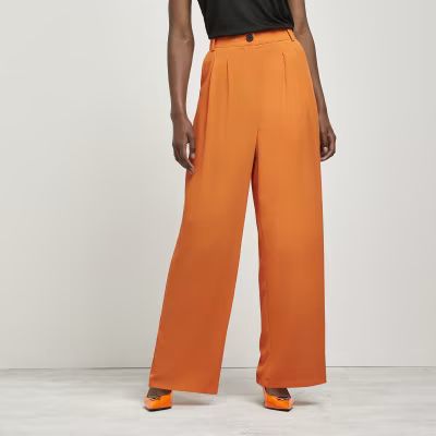 Orange wide leg trousers | River Island (UK & IE)