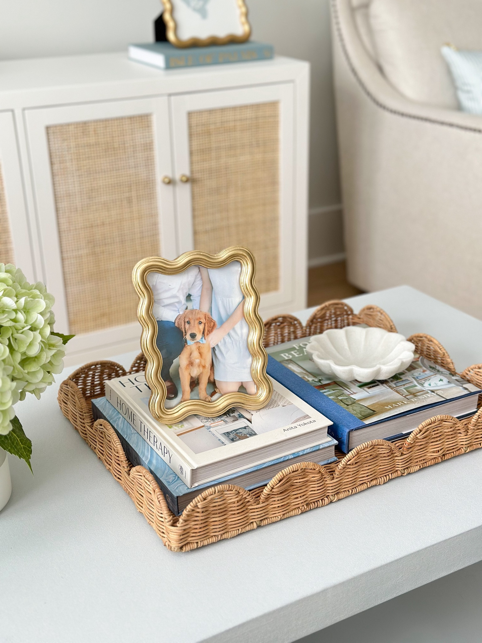 I got this designer inspired frame in the store at HomeGoods but I just found a really similar on online at Kohls! 

Gold wavy frame, coffee table decor, coffee table styling, scallop frame, scallop tray, designer look, serene and lily style, living room furniture, living room decor, coastal grandmillennial 

#LTKStyleTip #LTKHome #LTKFindsUnder50