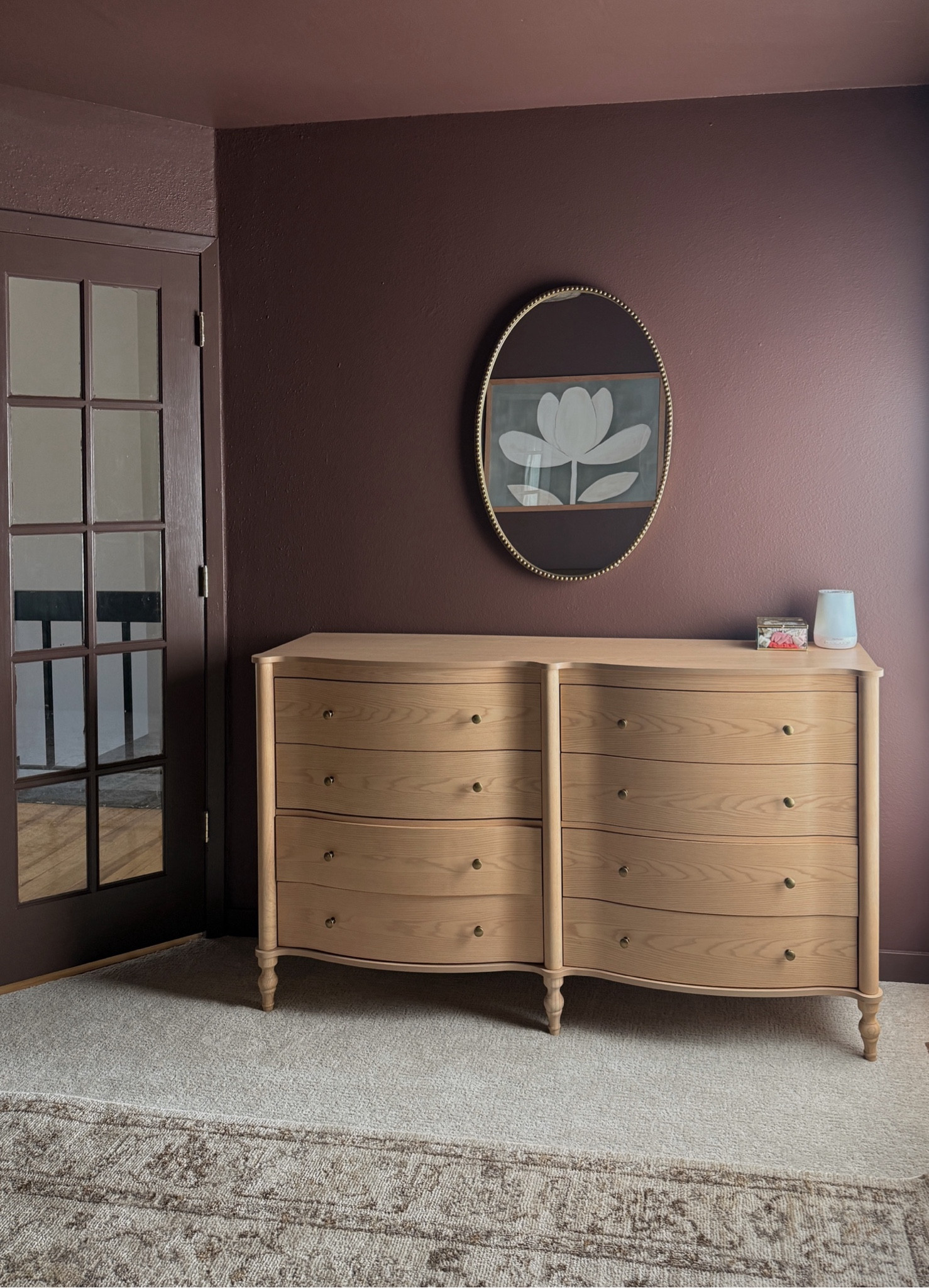 Modern vintage girls nursery, moody bedroom, wood dresser, gold mirror, floral wall art, feminine area rug.

#LTKHome