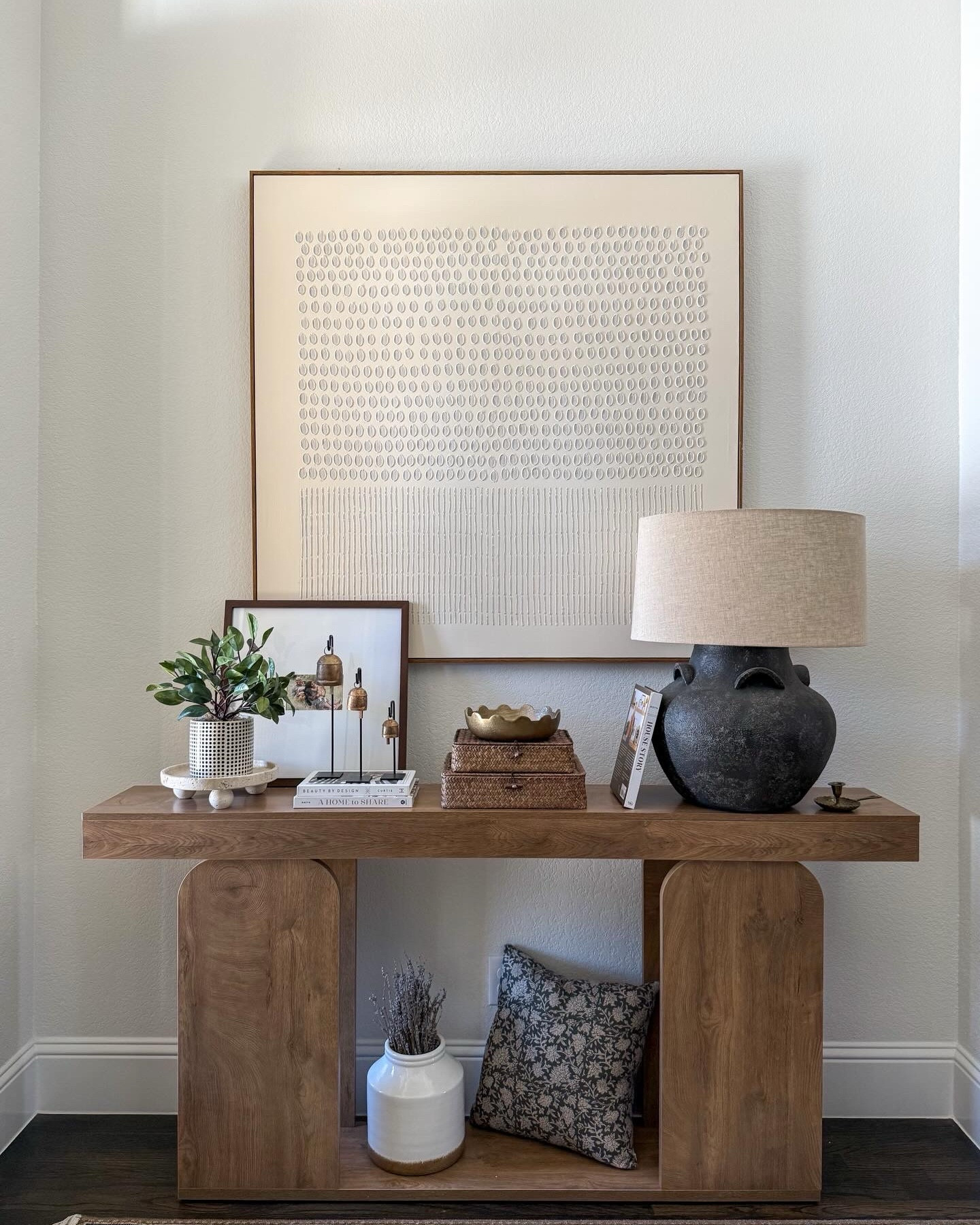 Afloral, faux plants, ceramic vases, terracotta vase, hobnail glazed planter, pothos plant, console table, home decor, table lamp, checkered bookends, scalloped wood chair, textured wall art, minimalist wall art, travertine tray with circular ball legs

#LTKSaleAlert #LTKU #LTKHome
