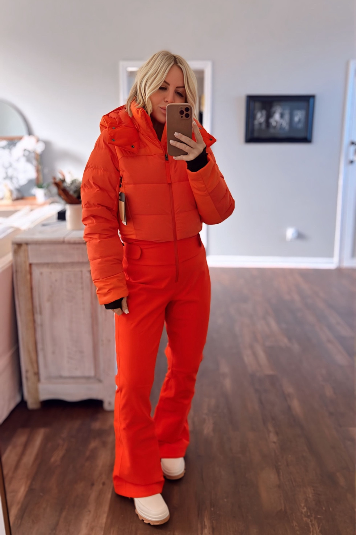 Ski season in style with this orange red ski suit. Built in puffer jacket is two in one for warmth + style. Fits true to size & this color is a standout in the white snow! Paired with weatherproof boots by SOREL!

Ski suit
Snowsuit 
The North Face
Puffer jacket 
Red ski suit 



#LTKActive #LTKstyletip #LTKSeasonal