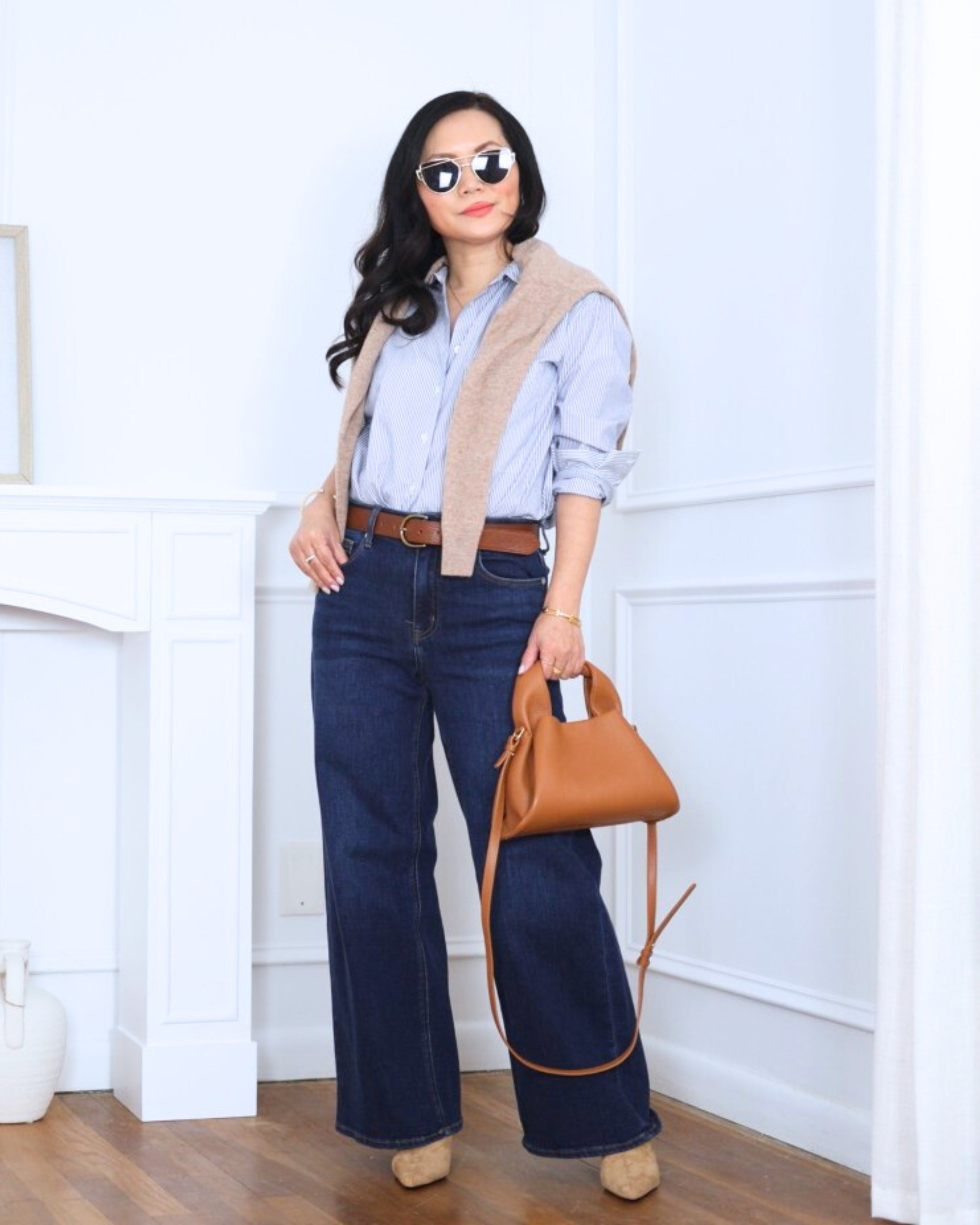 Classic layers done right — a button-down shirt with a sweater draped over the shoulders from Quince, paired with wide-leg jeans from Abercrombie. Effortless, polished, and always a good idea. I’m 5’2, wearing size XS.

#LTKootd #LTKPetite #LTKOver40