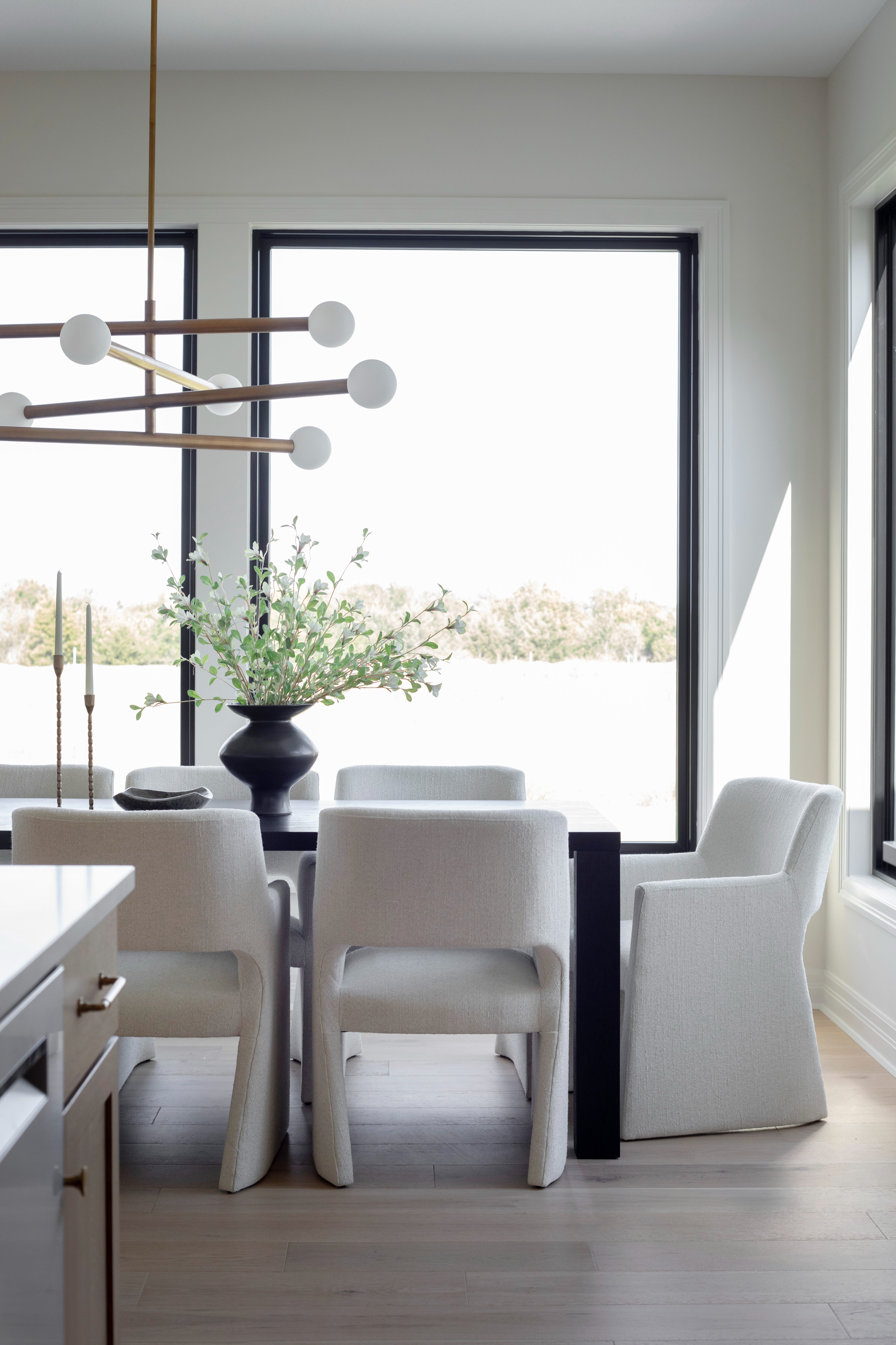 This modern dining room blends comfort and sophistication with every detail. The off-white upholstered dining chairs add a soft, tailored feel around a solid wood dining table that anchors the space. Overhead, the brass linear chandelier creates the perfect warm glow for everyday dining or entertaining guests.

Styled with neutral decor accents, a black sculptural vase, and tapered brass candlesticks, this space embodies the essence of organic luxury living—a balance of clean lines, cozy textures, and refined materials. Every piece is designed to make your dining area both inviting and effortlessly elevated.

Shop the look below for the dining chairs, table, lighting, and accessories that complete this timeless setup.

#LTKhome #LTKdiningroom #diningroomdecor #diningroomdesign #LTKfinds #neutralhomedecor #organicluxuryliving #modernhome #interiorstyling #LTKhomeinspo #diningroomfurniture #diningroomlighting #diningroomchandelier #homestyling #transitionalstyle #diningroomideas #diningroomgoals #modernluxuryhome #LTKshop #homedecorfinds #shopthelook 

 #LTKHome #LTKStyleTip #LTKFamily