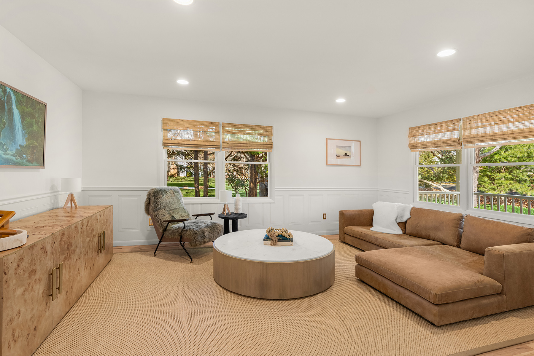 Living room with a neutral base—low profile sofa, burl wood cabinet, and a large textured rug.  Linking similar and exact pieces here.

#LTKHome #LTKSaleAlert