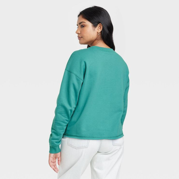 Women's Disney Caricature Graphic Sweatshirt - Green | Target