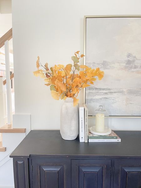 Shop gray credenzas, buffet table, yellow fall faux stems, wall art from McGee & Co 

#LTKSeasonal #LTKstyletip #LTKhome