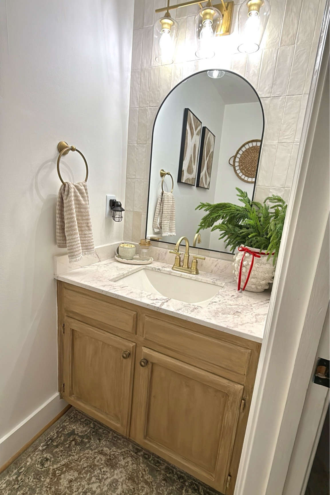 My powder room with a few festive touches for the season:

Seasonal candle 
Seasonal soap in a pretty dispenser 
Greenery stems
Velvet bow
…
You like also add a seasonal hand towel. 

#LTKHoliday #LTKSeasonal #LTKHome