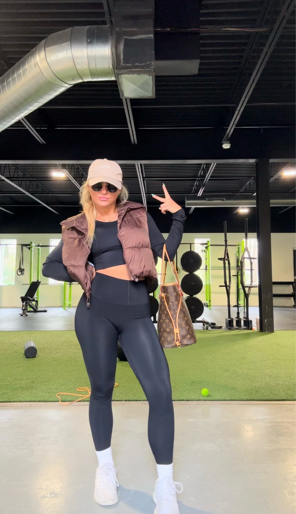 Weird pic LOL but on the go outfit/gym outfit for this chilly spring day🤎 This top has an open back and built in cup pads - size medium. The vest and leggings are both a size small. I can’t find these exact shoes online because they’re an older pair but I liked a similar pair & the accessory details. I know the monogram Neverfull is a bit dated, but it’s the only bag that holds everything I need!

#LTKstyletip #LTKSeasonal #LTKfit