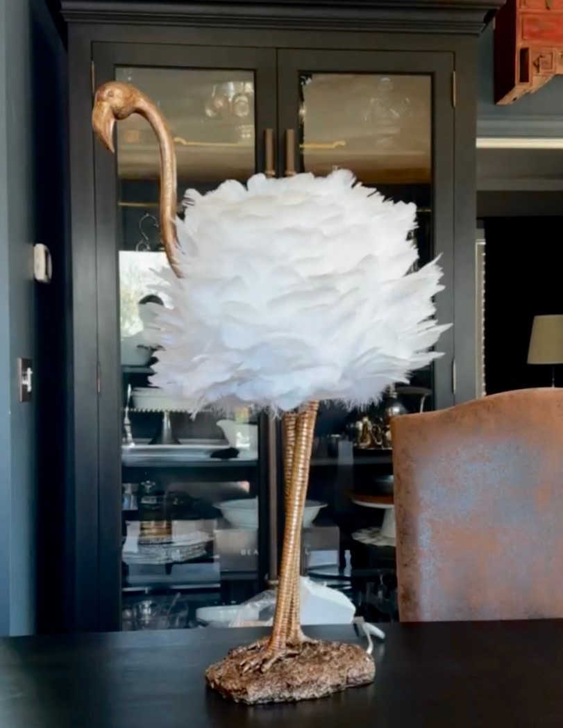 A gold and white feather flamingo shaped lamp that adds a touch of playful elegance to the space. Whimsical yet refined, it brings personality, warmth, and a soft glow that feels delightfully unexpected. ✨🤍🦩

 #WhimsicalDecor #StatementLighting #PlayfulElegance #UniqueHome #InteriorInspo #HomeDecor #DesignDetails #callsigndesign