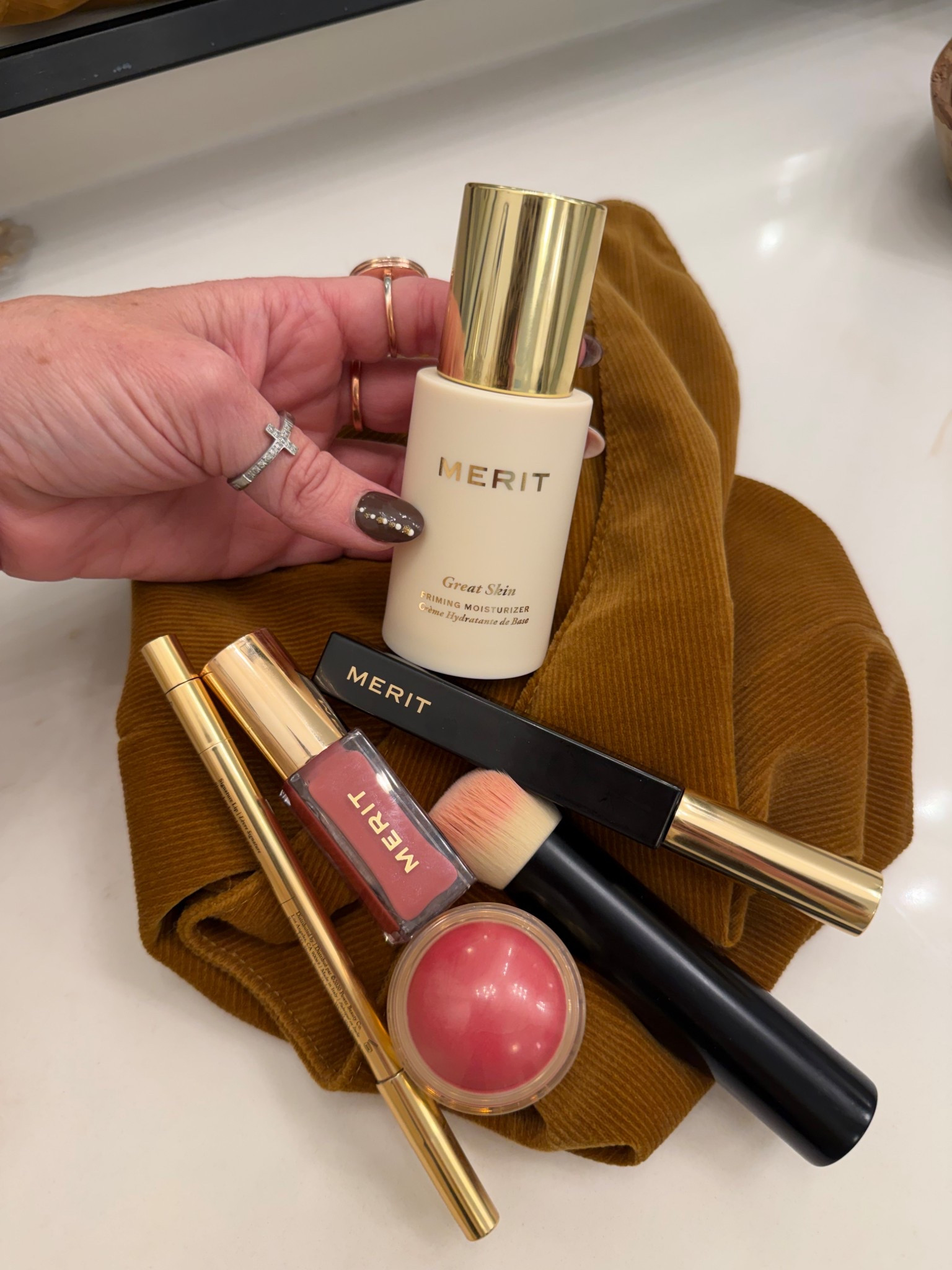 Bag full of merit must have beauty products 

#LTKBeauty #LTKOver40 #LTKFindsUnder50