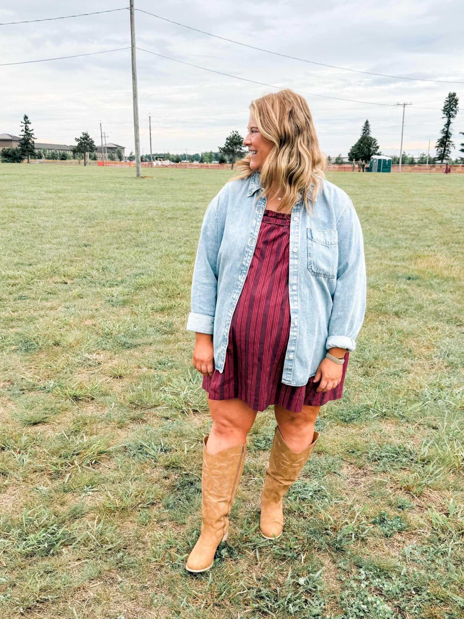 Bump friendly country concert outfit / flowy dress & a denim shirt.  Cowboy boots are wide calf friendly!
