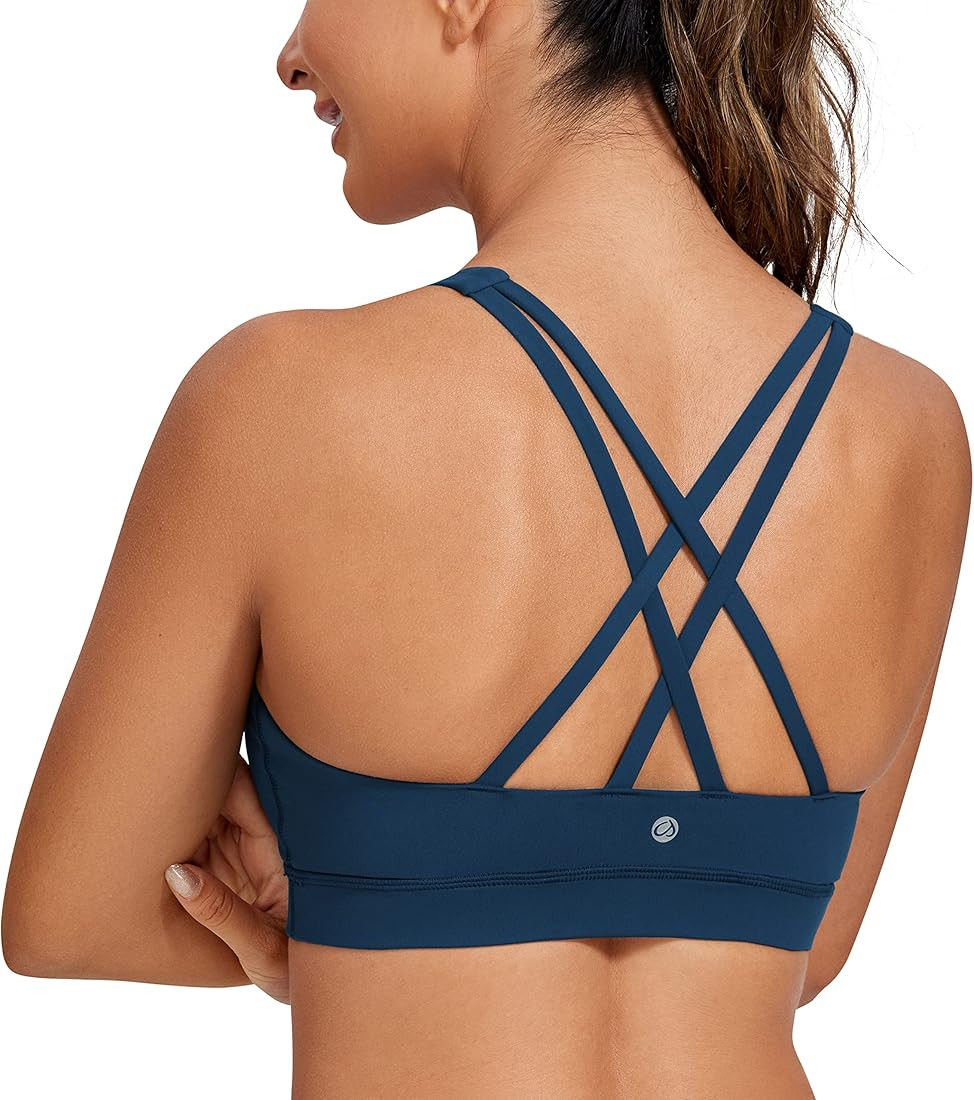 CRZ YOGA Women's Strappy Sports Bras Fitness Workout Padded Yoga Bra Criss Cross Back | Amazon (US)