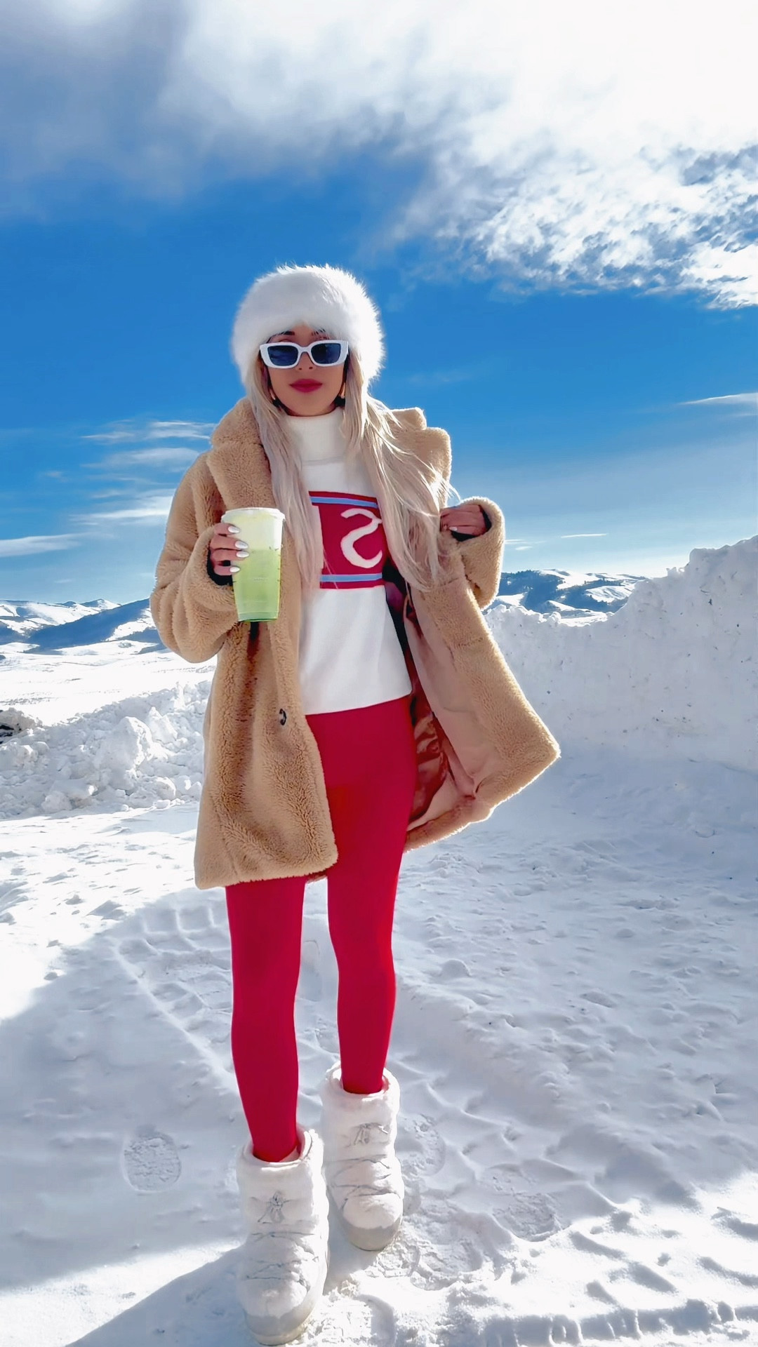 Ski sweater, red ski outfit, red winter look, iconic winter outfits, ski vacation outfit inspo, red leggings, ski in sweater, winter fashion trends, Russian fur hat, faux fur headband, white retro sunglasses, fur boots, Steve Madden winter boots, snow photos, photoshoot in the mountains, winter poses, snow outfit, schild sweater, ski letter sweater, aprés ski

#LTKTravel #LTKSeasonal #LTKStyleTip