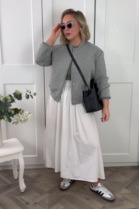 Day 5 of 7 days of spring outfits - I love the juxtaposition of the relaxed trainers and bomber with a feminine skirt 🐣

Skirt is old Mango, knit vest is massimo dutti 

#LTKstyletip #LTKmidsize #LTKSeasonal