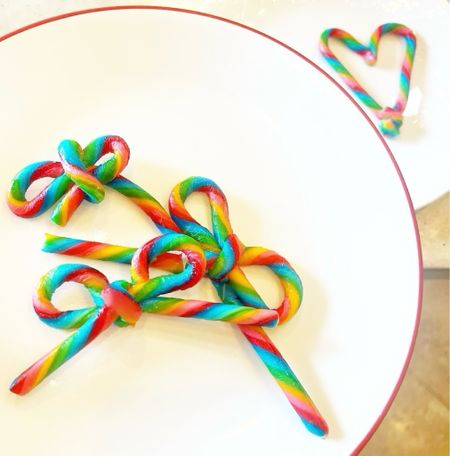 Tie a bow on it, 2023, that’s a wrap! 🎀🌈✨ To try the candy cane bow trend (but make it colorful!), here are some options for colorful candy cane alternatives! (note: we used regular size but minis would work best….!) I think the colorful version would be super cute for birthdays, showers, etc.

To try:

🎀 lay 2 candy canes layered / facing each other on a cooking sheet 

🎀 heat <barely> in the oven so that candy is malleable

🎀 shape your bow from the two candy canes and use the curve of another for the knot

🎀 let cool!
