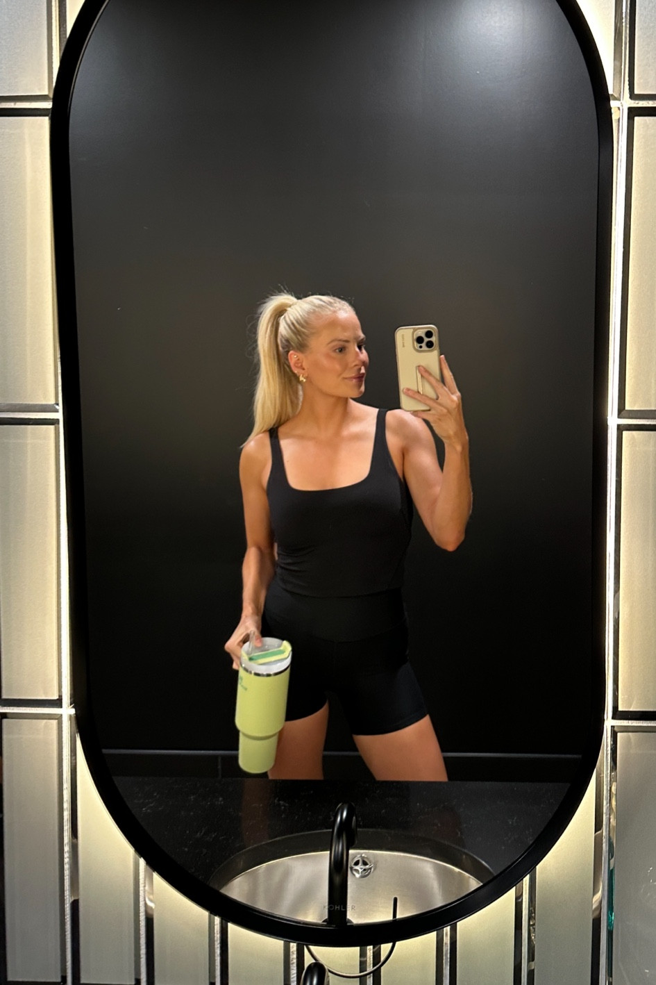 Size small in shorts, medium in tank, true size in shoes 