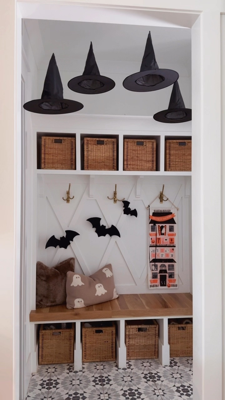 it’s spooky szn! 🐈‍⬛ | the witch hats can officially be hung, & my girls screamed with excitement when they got home 🤭 these are a hit every year! 

*our drop zone was custom built so unfortunately I have no links for tile or hooks*
share with your October lovin’ gals! 🖤
#halloween #spookyseason #halloweenhome #halloweenideas #witchhat #mudroom #halloweendecor 

#LTKHome #LTKSeasonal #LTKHalloween