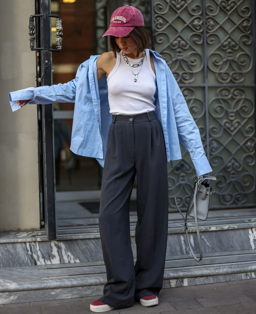 Fall casual outfit 
Grey pants
White tank top
Blue button down shirt 
Burgundy sneakers
Burgundy cap 
Silver layered necklace 
Grey handbag 

#LTKTravel #LTKStyleTip #LTKBeauty