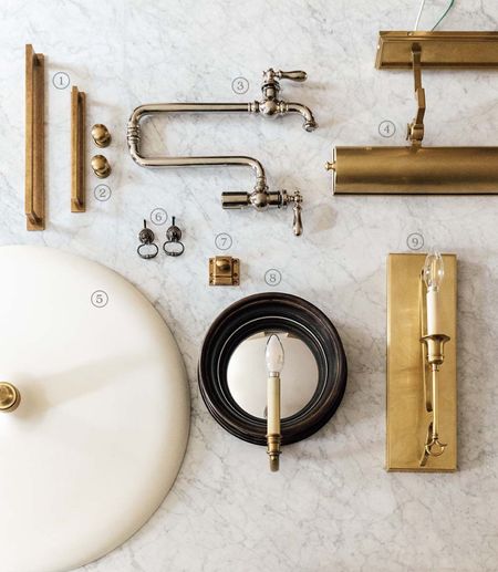 Polished nickel has a warm undertone, so it paired beautifully with all of the brass and bronze. None of it is matchy-matchy, and this flat lay with our kitchen details will forever be a formula for a classic combination for me.

Brass pulls & knobs, polished nickel pot filler, brass picture light, pendant lights, bronze ring pull, brass cupboard latches, bronze mirror sconces, taper sconces

#LTKhome #LTKstyletip